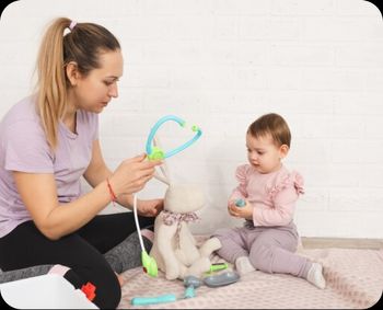 Teacher and Infant playing