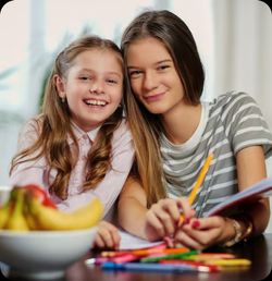 two preschool girls smiling